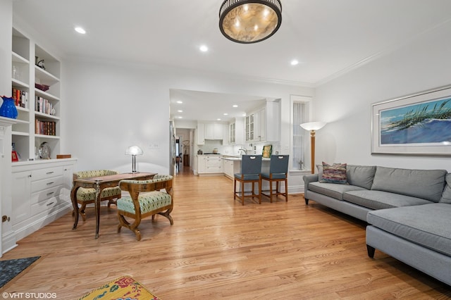 2535 N Burling St, Chicago, IL 60614 - living room featuring crown molding, light wood-style flooring, and recessed lighting