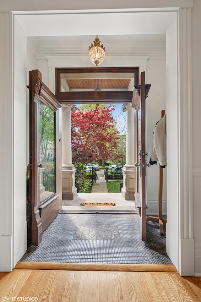 2535 N Burling St, Chicago, IL 60614 - foyer entrance featuring wood finished floors and ornamental molding