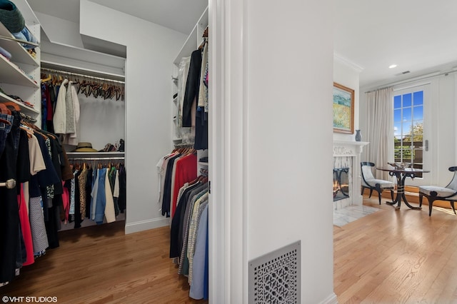 2535 N Burling St, Chicago, IL 60614 - spacious closet featuring wood finished floors and a tile fireplace