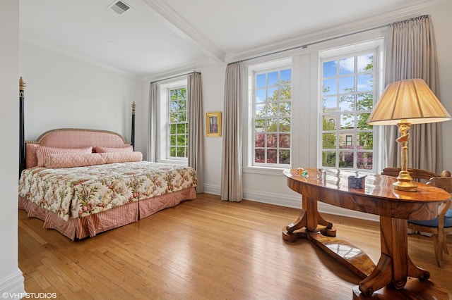2535 N Burling St, Chicago, IL 60614 - bedroom with light wood-style floors, crown molding, baseboards, and beamed ceiling