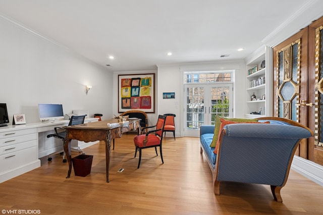 2535 N Burling St, Chicago, IL 60614 - office featuring ornamental molding, light wood-style floors, built in shelves, recessed lighting, and french doors