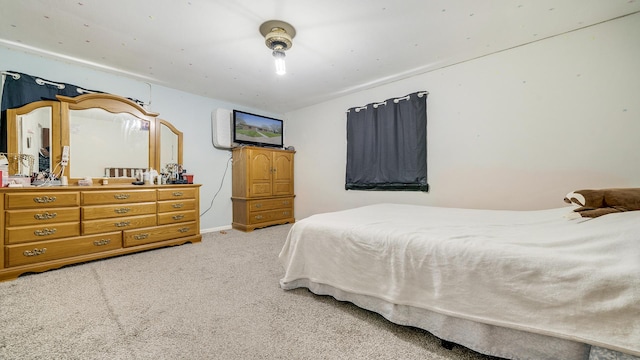 bedroom featuring carpet floors and baseboards