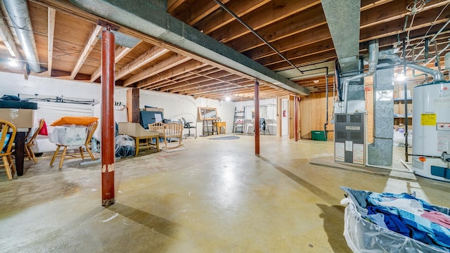 unfinished basement featuring heating unit and water heater