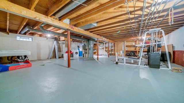 below grade area featuring heating unit and independent washer and dryer