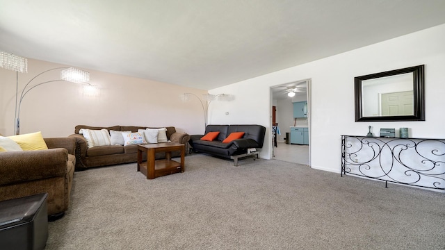 carpeted living room featuring ceiling fan