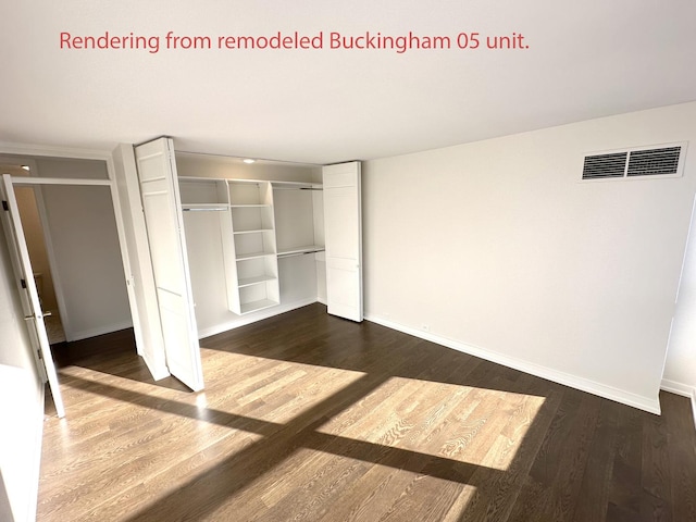 unfurnished bedroom with baseboards, visible vents, dark wood finished floors, and a closet