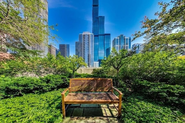 view of community featuring a view of city and a deck