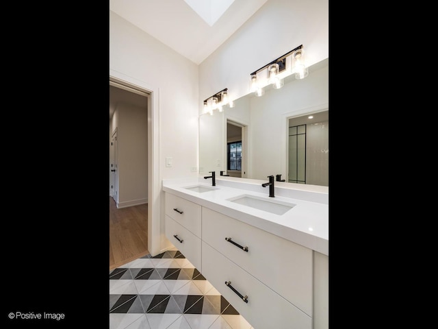 118 Lockerbie Ln, Wilmette, IL 60091 - full bathroom with double vanity, a shower with shower door, and a skylight