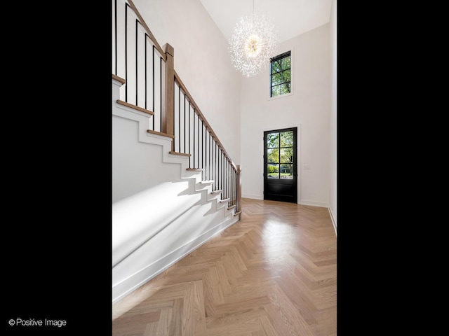 118 Lockerbie Ln, Wilmette, IL 60091 - entrance foyer featuring a chandelier, a towering ceiling, stairway, and baseboards