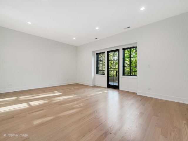118 Lockerbie Ln, Wilmette, IL 60091 - spare room featuring baseboards, light wood-style floors, and recessed lighting