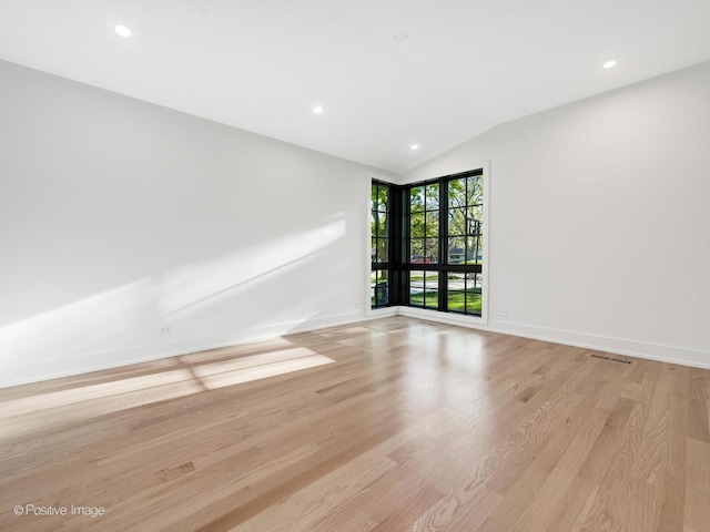 118 Lockerbie Ln, Wilmette, IL 60091 - unfurnished room with light wood finished floors, lofted ceiling, recessed lighting, and baseboards