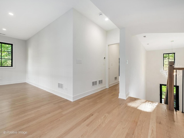 118 Lockerbie Ln, Wilmette, IL 60091 - empty room featuring light wood finished floors, healthy amount of natural light, baseboards, and recessed lighting