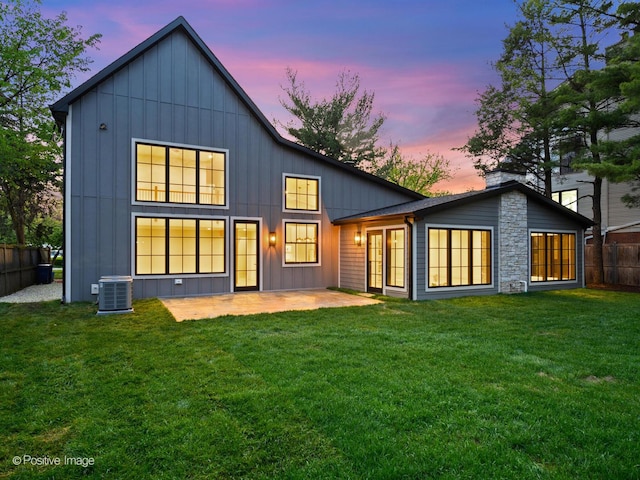 118 Lockerbie Ln, Wilmette, IL 60091 - back of house featuring a patio area, board and batten siding, and cooling unit