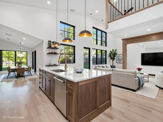 118 Lockerbie Ln, Wilmette, IL 60091 - kitchen with a sink, light wood-style flooring, high vaulted ceiling, dishwasher, and open floor plan