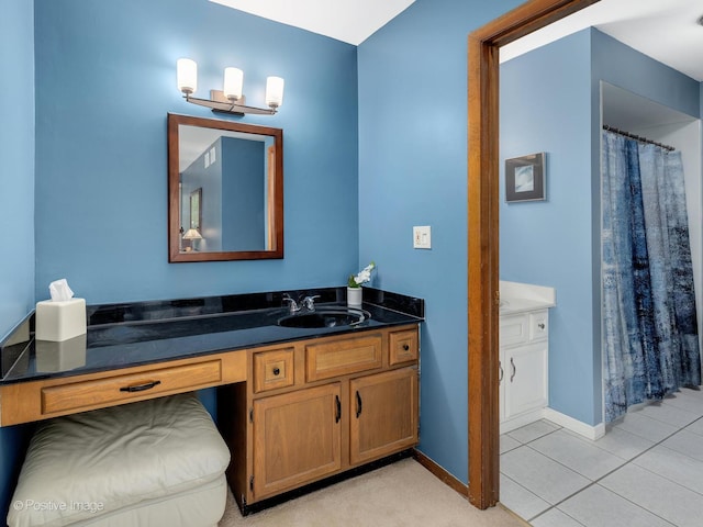 full bathroom with vanity, baseboards, and tile patterned floors