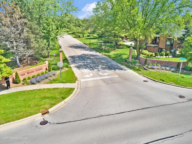 exterior space with a lawn and aphalt driveway