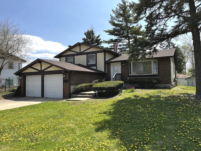tri-level home featuring brick siding, a garage, driveway, and a front yard