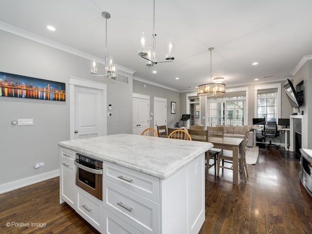 kitchen featuring a chandelier, stainless steel oven, crown molding, recessed lighting, and dark wood-type flooring