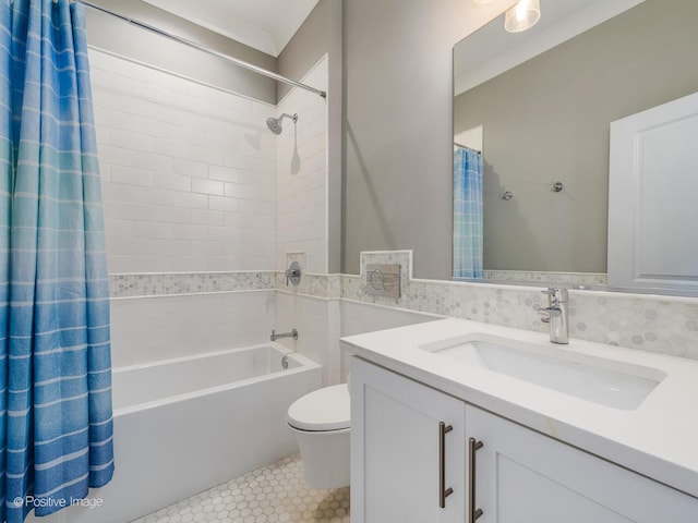 bathroom featuring toilet, shower / bath combination with curtain, vanity, and tile patterned flooring
