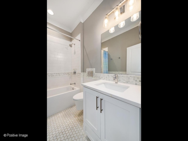 full bathroom featuring toilet, vanity, ornamental molding, shower / bathtub combination, and tile patterned flooring