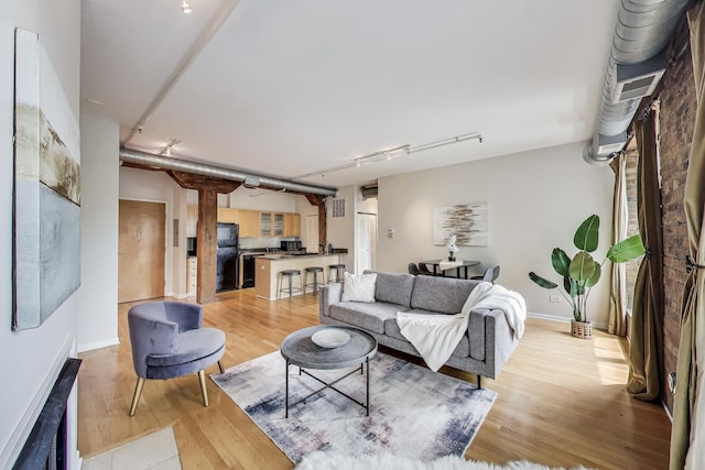 1735 W Diversey Pkwy Unit 206, Chicago, IL 60614 - living room with light wood-style flooring and baseboards