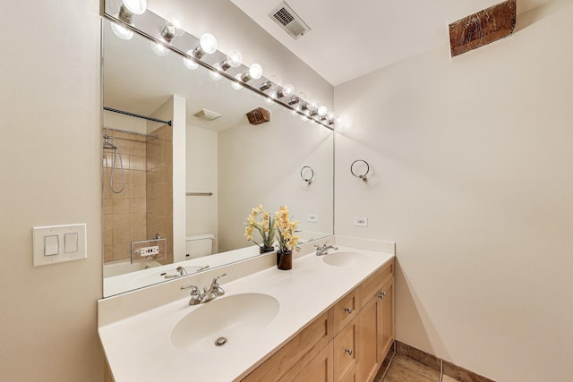 1735 W Diversey Pkwy Unit 206, Chicago, IL 60614 - bathroom with double vanity, tile patterned floors, and tub / shower combination