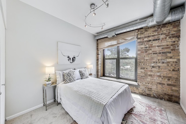 1735 W Diversey Pkwy Unit 206, Chicago, IL 60614 - bedroom with carpet floors and brick wall
