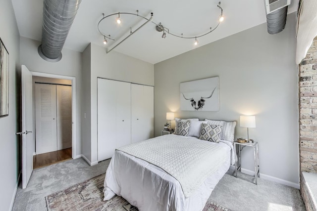 1735 W Diversey Pkwy Unit 206, Chicago, IL 60614 - bedroom featuring light colored carpet, a closet, and track lighting