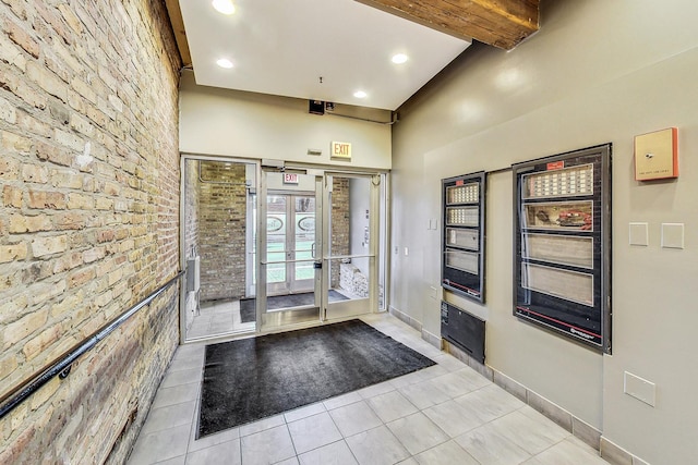 1735 W Diversey Pkwy Unit 206, Chicago, IL 60614 - entryway with light tile patterned floors, french doors, and recessed lighting