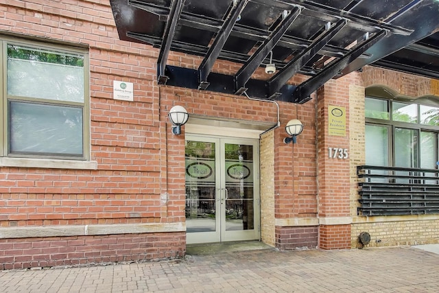 1735 W Diversey Pkwy Unit 206, Chicago, IL 60614 - doorway to property with french doors and brick siding