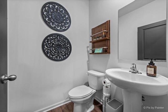 10102 Jonamac Ave, Huntley, IL 60142 - half bathroom featuring wood finished floors, baseboards, toilet, and a sink