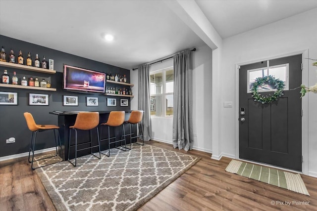 10102 Jonamac Ave, Huntley, IL 60142 - indoor dry bar with wood finished floors and baseboards