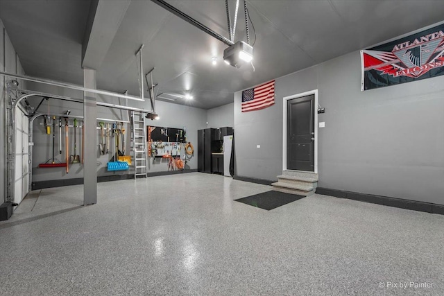 10102 Jonamac Ave, Huntley, IL 60142 - garage with baseboards and a garage door opener