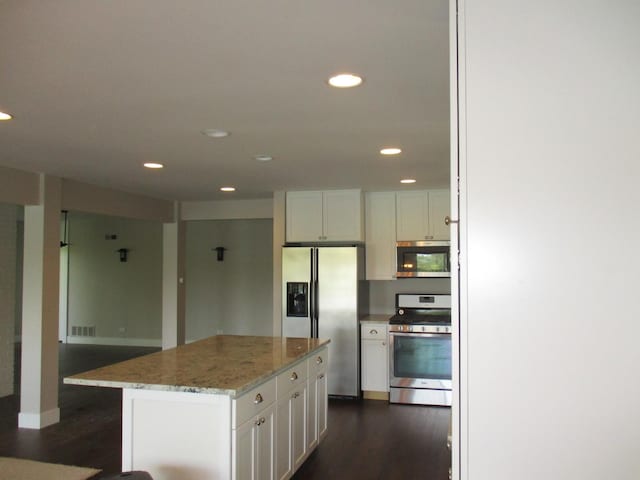 27094 W Lakeview Dr S, Lake Barrington, IL 60084 - kitchen featuring stainless steel appliances, dark wood-type flooring, white cabinets, light stone countertops, and recessed lighting