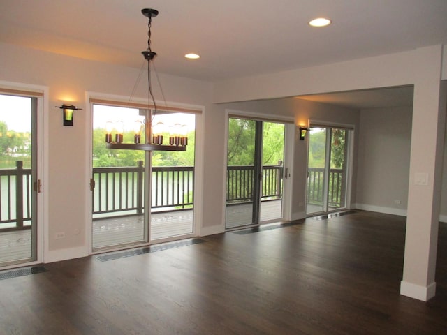 27094 W Lakeview Dr S, Lake Barrington, IL 60084 - empty room featuring wood finished floors, recessed lighting, and a chandelier
