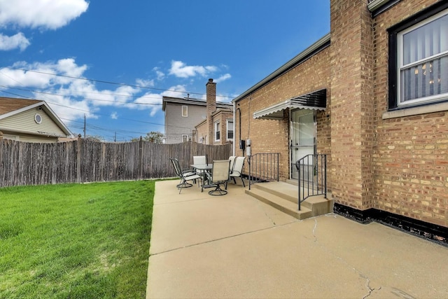 view of patio with outdoor dining area and fence