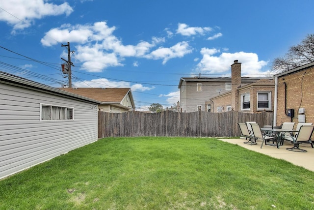 view of yard with fence and a patio area