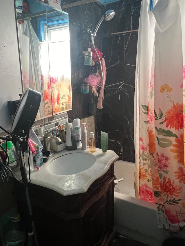 bathroom with vanity and shower / bath combo