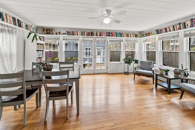 sunroom / solarium featuring french doors