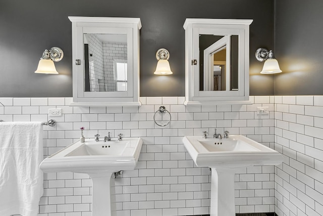bathroom featuring tile walls and wainscoting