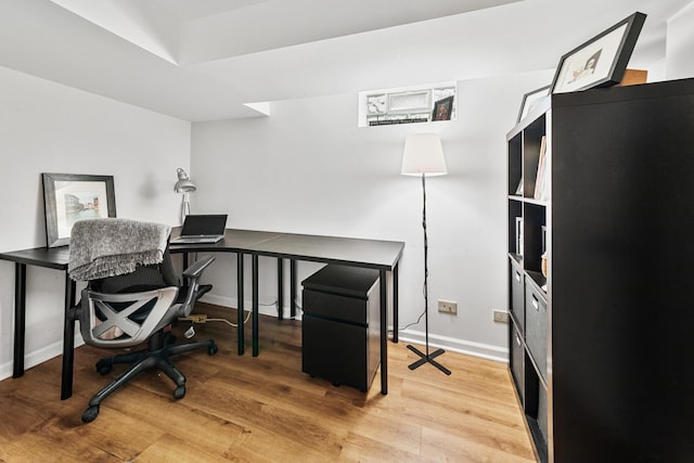 office with baseboards and wood finished floors