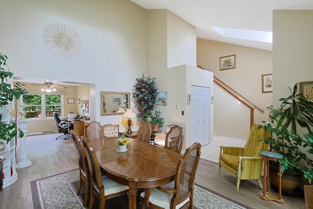 281 Windsor Dr, Bartlett, IL 60103 - dining space with high vaulted ceiling, wood finished floors, a skylight, and ceiling fan