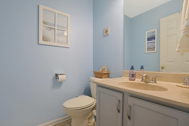 half bathroom with toilet, tile patterned flooring, and vanity