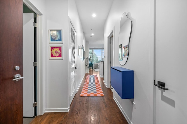 corridor with recessed lighting, baseboards, and wood finished floors