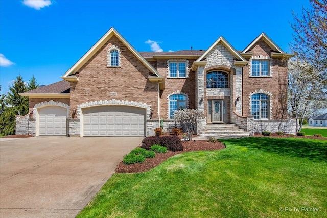 view of front facade with brick siding, stone siding, driveway, and a front yard