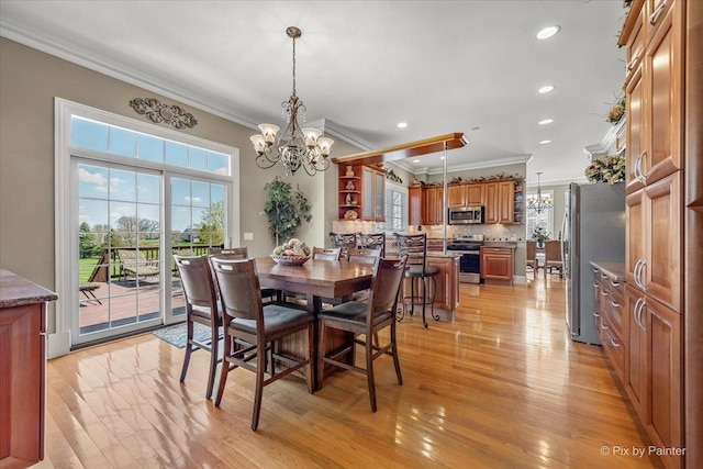 dining room with recessed lighting, a notable chandelier, ornamental molding, and light wood-type flooring