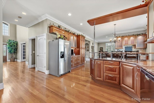 kitchen with crown molding, light wood-style floors, recessed lighting, tasteful backsplash, and stainless steel appliances
