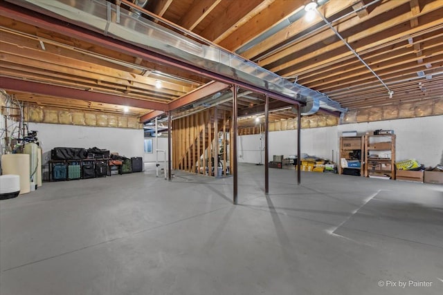 unfinished basement featuring stairway