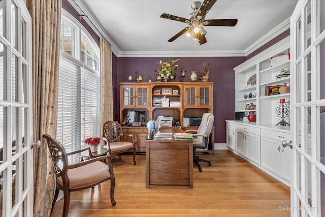office space with crown molding, ceiling fan, french doors, and light wood-type flooring