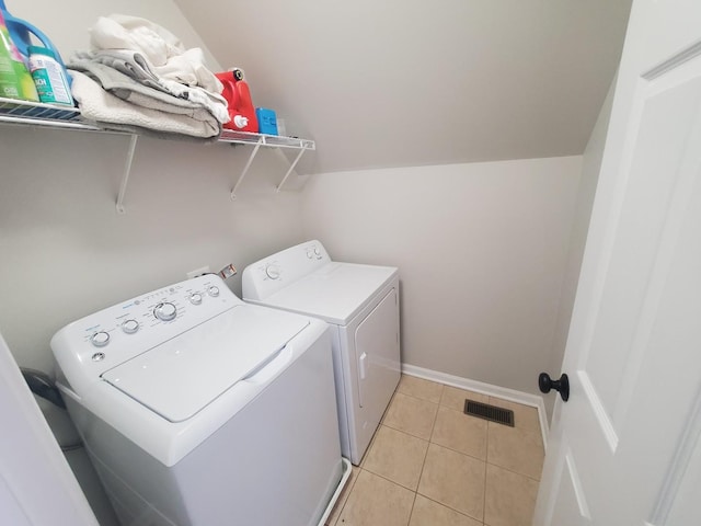 368 W Winchester Dr, Round Lake, IL 60073 - washroom featuring laundry area, visible vents, washing machine and dryer, baseboards, and light tile patterned flooring